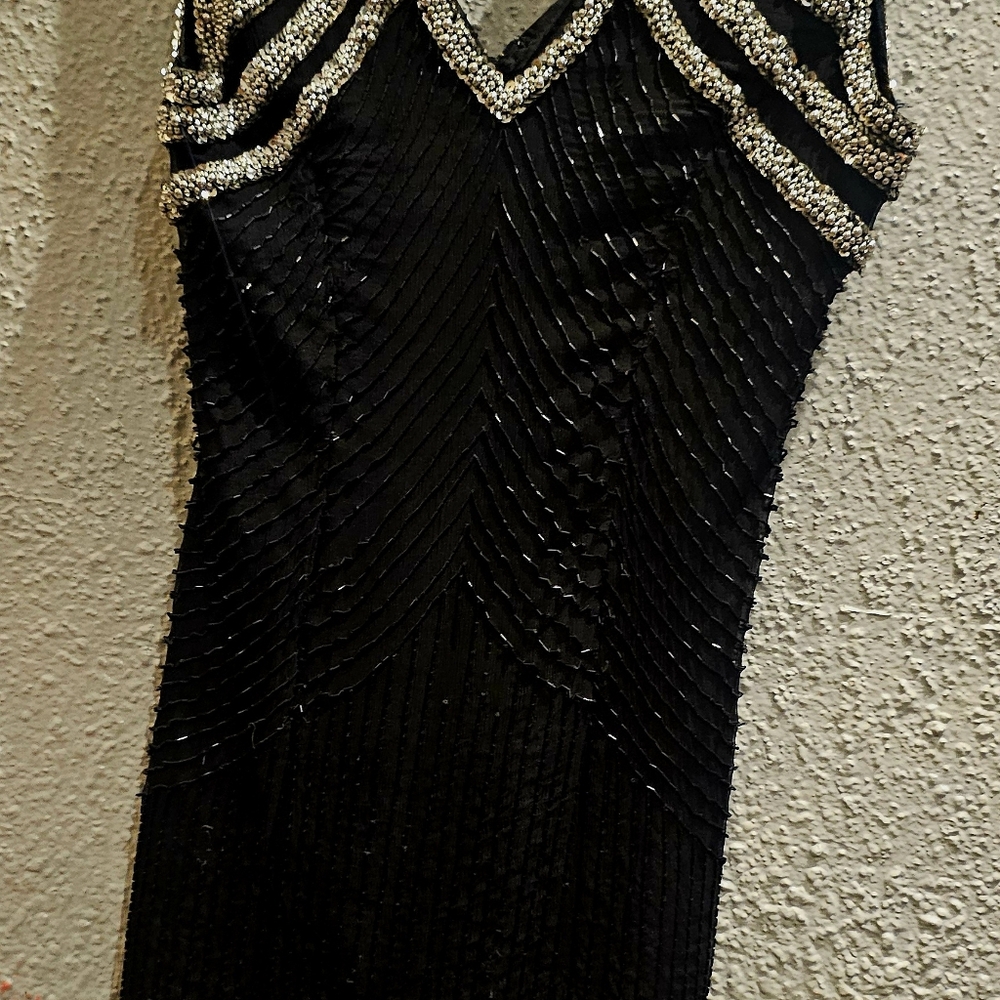 Pre-owned black and silver party dress.